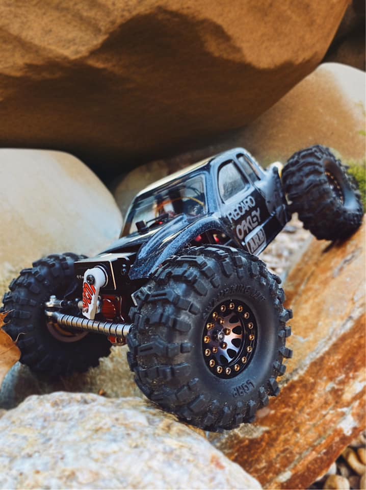 Micro RC crawler climbing rocks